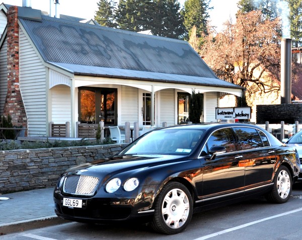 Luxury Bentley Flying Spur outside Botswana Butchery Queenstown.